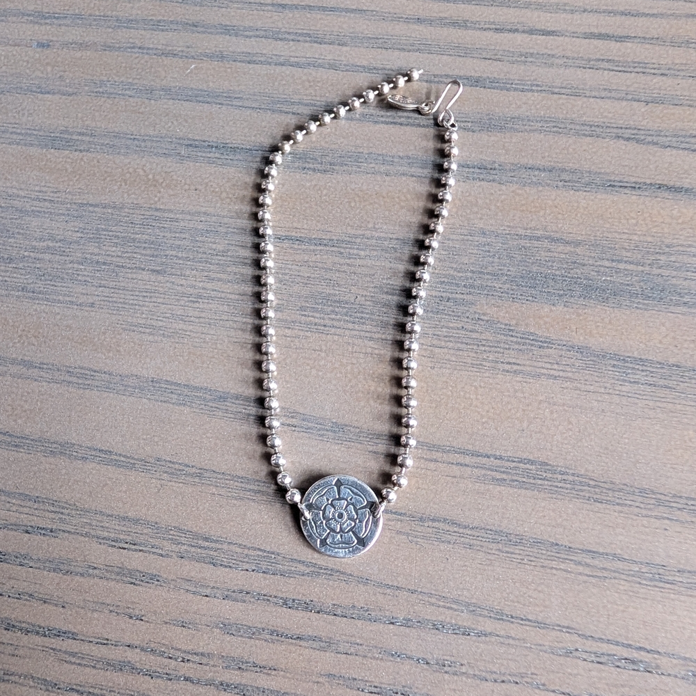 Silver Beaded Bracelet with Floral Medallion
